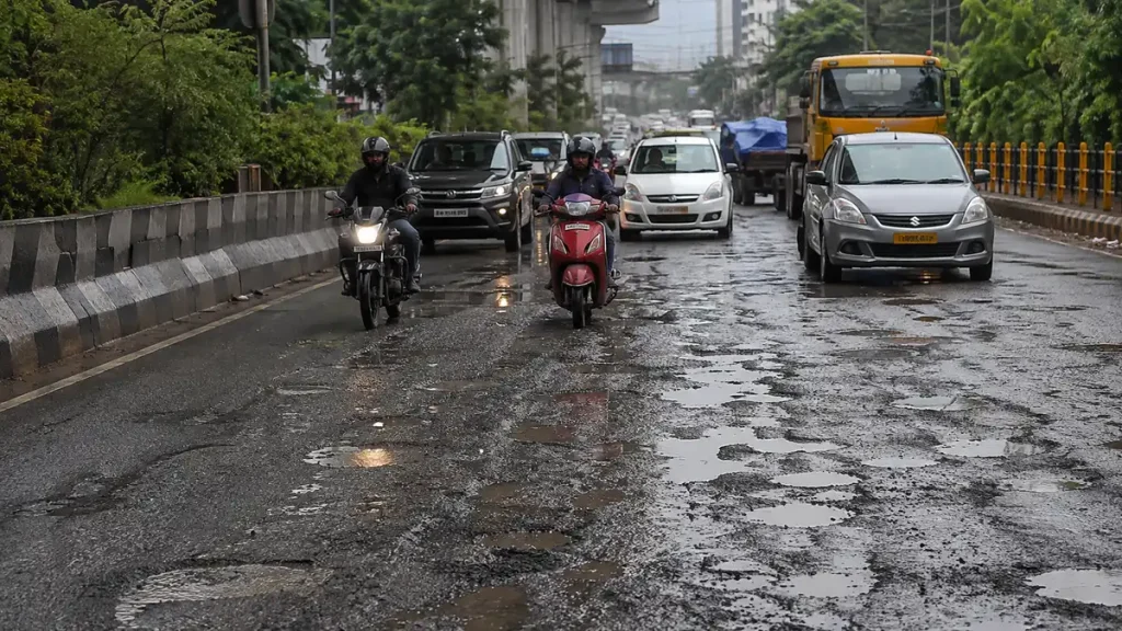 How Rainfall and Potholes Combine to Slow Hyderabad Traffic in Hyderabad